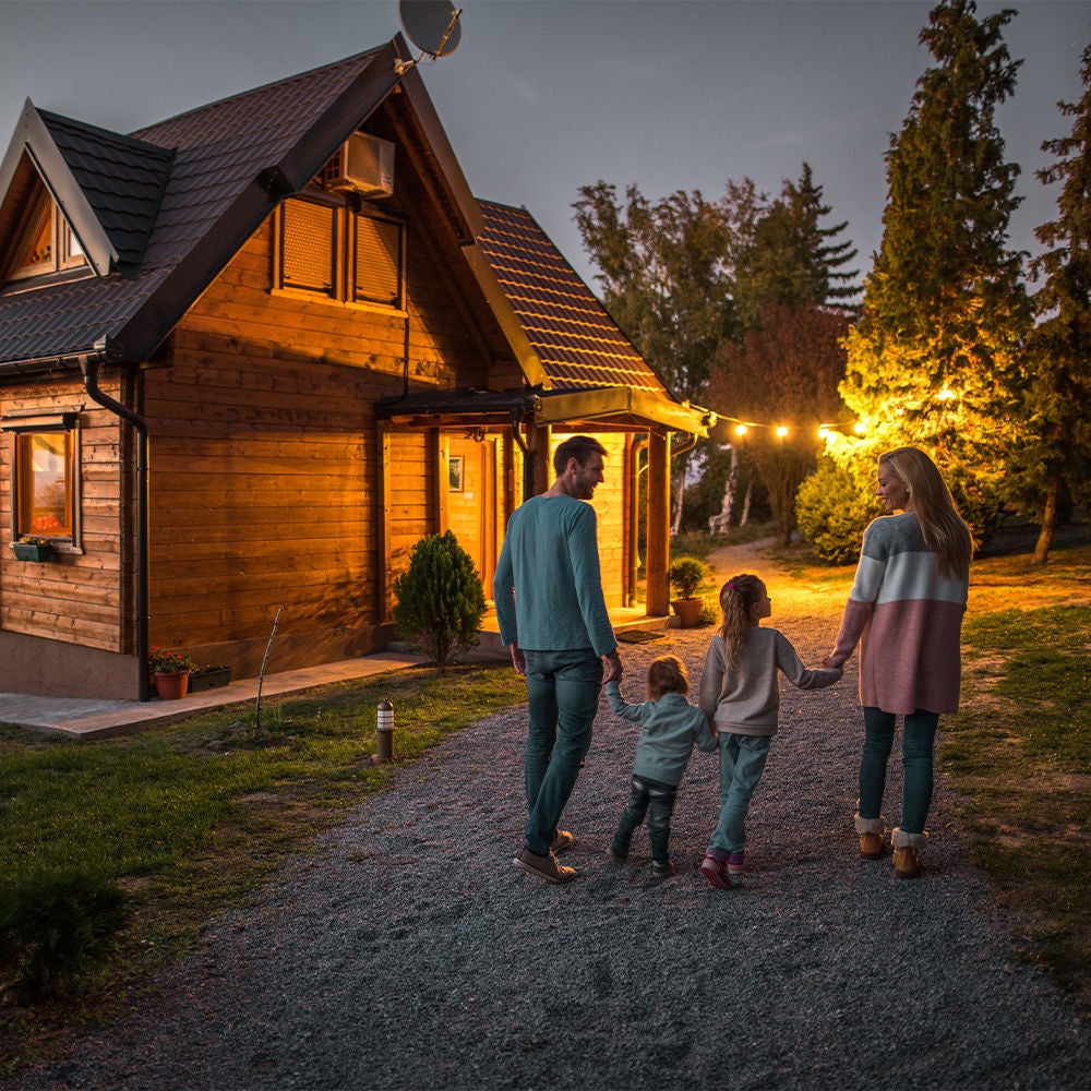 Family of four walking back to their cabin